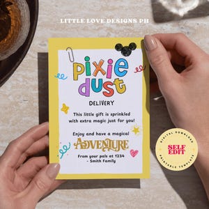 May include: A yellow card with the words "pixie dust" in colorful letters. The card includes the text "Delivery" and "Enjoy and have a magical adventure". A Mickey Mouse head is drawn at the top. The card is held by two hands.