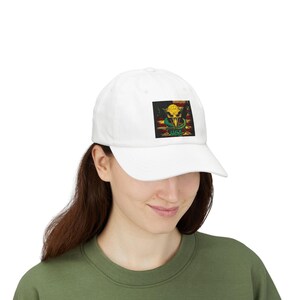 May include: White baseball cap with a colourful graphic design. The design features a skull, a snake, and the word "USA" in green. The cap is made of a soft material and has a curved peak.