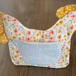 May include: A set of three ceramic mugs with a speckled, matte finish. The mugs are in shades of cream, light gray, and dark gray. Each mug has a simple, minimalist design, perfect for coffee or tea.