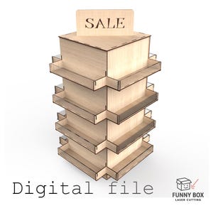 以下が含まれることがあります： 複数の棚と上部に「SALE」のサインが付いた木製の小売ディスプレイスタンド。スタンドは明るい色の木材で作られており、モダンで幾何学的なデザインです。「Digital file」という言葉が画像の下部にあります。