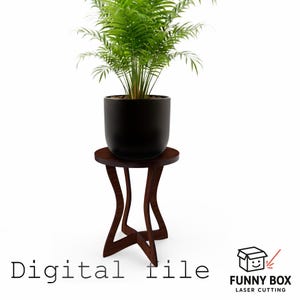 Puede incluir: Un soporte de planta de madera marrón oscuro con una parte superior redonda y un diseño de patas curvadas único. Una maceta negra contiene una exuberante planta verde. El texto "Digital file" está en la parte inferior, con el logotipo "Funny Box Laser Cutting".