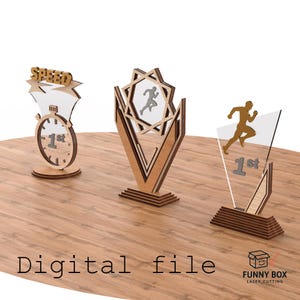 May include: Three wooden trophies with clear acrylic accents. One features a stopwatch with "1st" and "SPEED" text, another has a runner silhouette, and the third has a star-shaped design with a runner. The phrase "Digital file" is at the bottom.