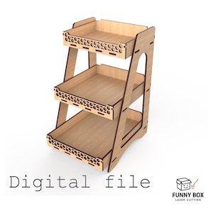 May include: A three-tiered wooden display shelf with a light brown finish. The edges are a darker brown. The top edges of the shelves have a honeycomb pattern. The text "Digital file" is at the bottom.
