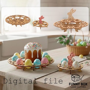May include: Wooden Easter egg holders with laser-cut designs, featuring a bunny silhouette. The holders are displayed with decorated eggs and a frosted cake. The text "Digital file" and "FUNNY BOX LASER CUTTING" are visible.