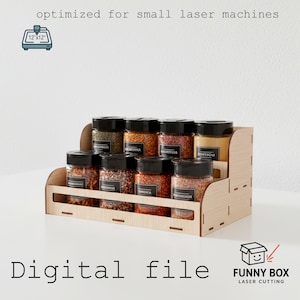 May include: A wooden spice rack with two tiers, holding several glass jars filled with various spices. The rack is designed for small laser machines and includes the text "Digital file" and "FUNNY BOX LASER CUTTING".