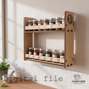 May include: A two-tiered wooden spice rack with multiple glass jars filled with various spices. The rack is mounted on a white wall and features decorative cutouts and a logo. The words "Digital file" are at the bottom.