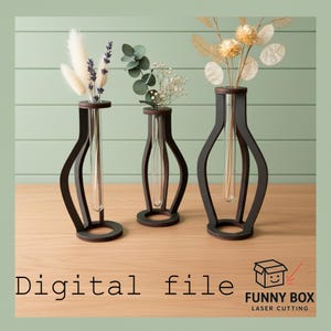 May include: Three dark brown wooden vases with clear glass tubes, each holding dried flowers. The vases have a unique, curved design and are displayed on a wooden surface. The words "Digital file" are at the bottom of the image.