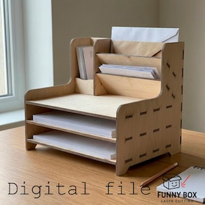 May include: A light-colored wooden desk organizer featuring two horizontal paper trays and a vertical tiered mail sorter. The structure is assembled with visible interlocking joints. The text "Digital file" and "FUNNY BOX LASER CUTTING" appear at the bottom.