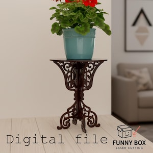 Puede incluir: Un soporte para plantas de corte láser marrón oscuro con un diseño ornamental y enrollado. Una maceta turquesa con flores rojas encima. Las palabras "Digital file" están en la parte inferior izquierda y "FUNNY BOX LASER CUTTING" en la inferior derecha.