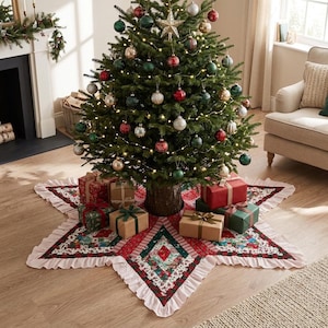 May include: A star-shaped Christmas tree skirt featuring a patchwork pattern of red, green, and white floral and geometric fabrics with a ruffled light pink border, placed under a decorated evergreen tree with ornaments and wrapped gifts.