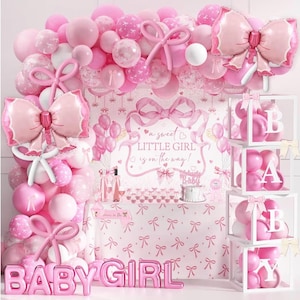May include: A pink baby shower decoration set with a balloon arch, large bow-shaped balloons, and a table with a bow-themed tablecloth. The words "BABY GIRL" are spelled out in pink balloons. The backdrop reads "a sweet LITTLE GIRL is on the way!"