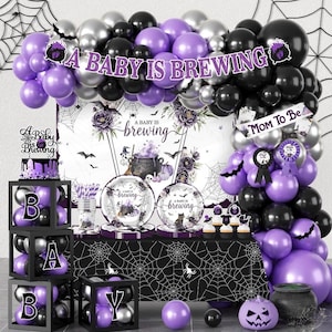May include: A baby shower party set featuring a balloon arch in purple, black, and silver, a backdrop with a cauldron graphic and the text A BABY IS BREWING, matching plates, a table cover with spiderwebs, and black boxes with letters spelling BABY.