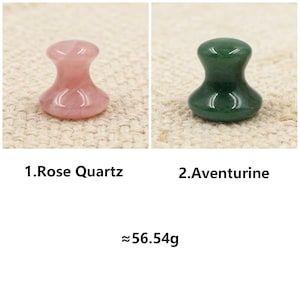 May include: Two gemstone massage tools: a pink Rose Quartz and a green Aventurine. The Rose Quartz is on the left, and the Aventurine is on the right. The approximate weight is 56.54 grams.