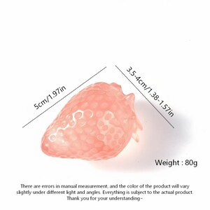 May include: A translucent, pink strawberry-shaped object. The strawberry measures 5cm/1.97in in length and 3.5-4cm/1.38-1.57in in width. It weighs 80g. The image includes text about measurement errors and color variations.