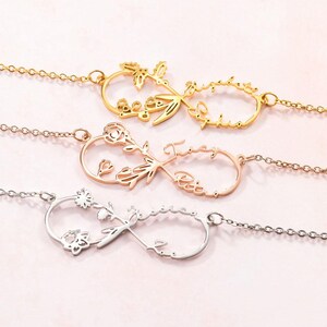 May include: Three personalized infinity necklaces in gold, rose gold, and silver. Each necklace features a floral design and a name. The gold necklace has a butterfly and the name "Sophia". The rose gold necklace has a rose and the name "Tracy". The silver necklace has a flower and the name "Jessica".