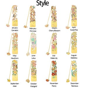 May include: A collection of twelve gold-toned metal bookmarks, each featuring intricate floral and butterfly cutouts with colorful enamel accents. Each bookmark includes a delicate gold chain with a small floral charm and text labels.
