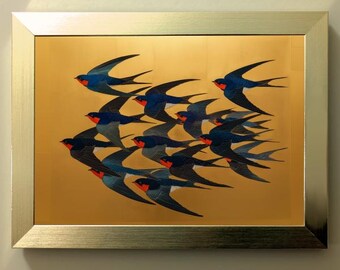 May include: A framed artwork featuring a flock of swallows in flight. The birds have blue and black wings with red markings, set against a gold background. The frame is a metallic silver color.