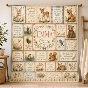 May include: A quilted wall hanging featuring a central name plate reading EMMA Grace surrounded by illustrations of a rabbit, deer, fox, bear, duck, frog, squirrel, and lamb, interspersed with floral motifs and various Bible verses in English.