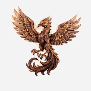 May include: A detailed, brown wooden carving of a phoenix with outstretched wings. The bird's feathers and tail are intricately carved, and its talons are extended. The phoenix is a symbol of rebirth and renewal.