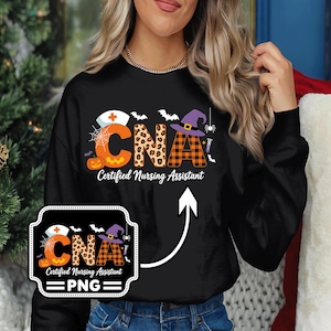 May include: Black sweatshirt with a Halloween-themed design. The design features the letters "CNA" with a nurse's hat, pumpkin, bats, spider, and witch hat. The text "Certified Nursing Assistant" is below the letters.