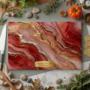 May include: A rectangular cutting board with a red, gold, and white marbled design. The board has a gold label that reads "Happily Ever After 11 Years". The board is surrounded by kitchen items.