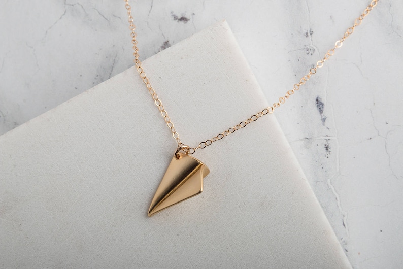 Gold paper aeroplane charm necklace gold charm necklace image 0