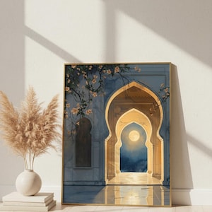 May include: A framed art print depicting an arched doorway with a full moon visible through the opening. The artwork features a blue and gold color palette, with floral accents and a reflective floor. The print is displayed on a wooden floor.