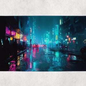May include: A bath mat with a digital art print of a neon-lit city street at night. The scene is awash in blue, pink, and yellow hues, with reflections on the wet pavement. Cars are visible on the road.