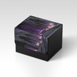May include: A black, textured box with a lid featuring a purple and grey abstract design. The box has a rectangular shape and a slightly angled lid, creating a modern aesthetic. The design on the lid has a gothic architectural theme.