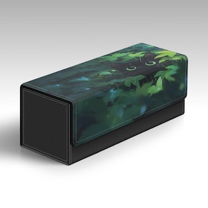 May include: A rectangular storage box with a black base and a lid featuring a graphic illustration of a black cat hiding among green leaves. The cat has visible bright eyes peering out from the foliage, which is accented with small blue light spots.