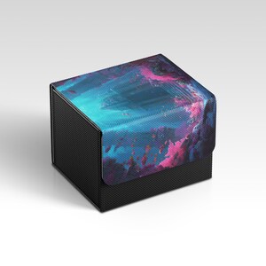 May include: A black box with a textured surface and a lid featuring a vibrant abstract design in shades of blue, pink, and purple. The box is rectangular and appears to be made of durable material.