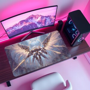 May include: A computer desk setup featuring a curved monitor displaying a mountain landscape, a black computer tower, and a large rectangular mousepad. The mousepad has a detailed illustration of a white and gold mechanical angel.