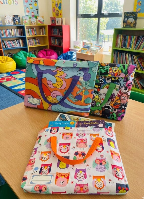 Durable, water & stain resistant, lined library book bag with velcro closure. 28 × 38 × 3cm