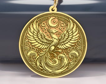 May include: Gold-colored pendant necklace featuring a detailed phoenix design. The circular pendant showcases the mythical bird with outstretched wings, a crescent moon, and intricate patterns. The necklace has a delicate chain.