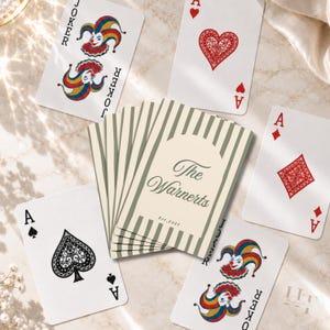 May include: A deck of custom playing cards featuring a cream-colored back with dark green vertical stripes and the text The Warnerts Est. 2027. The deck is surrounded by individual playing cards including the Ace of Hearts, Diamonds, Spades, and Jokers.