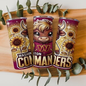 May include: Three insulated tumblers with a glittery gold background. Each tumbler features a cartoon bull wearing a burgundy and gold jacket, sunflowers, and the text "Washington Commanders."