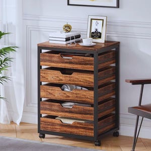 May include: A rolling storage cart with five drawers. The drawers have a wood grain finish and are set in a black metal frame. The top of the cart has a wood grain finish. The cart has four wheels.