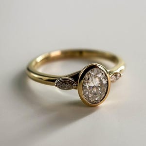0.75 CT Oval Cut Moissanite Engagement Ring, 14K Solid Gold Ring, Bezel Setting Ring, Three Stone Ring, Trilogy Ring, Proposal Ring For Her