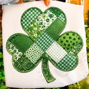 May include: A set of three ceramic mugs with a speckled, matte finish. The mugs are in shades of cream, light grey, and dark grey. Each mug has a simple, minimalist design, ideal for coffee or tea.