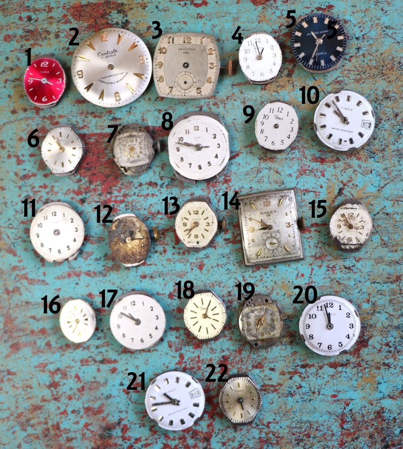 May include: A collection of 22 vintage wristwatches in various styles and colours, including silver, gold, and black. The watches are arranged in a grid pattern on a turquoise blue surface. Some of the watches have Roman numeral markings, while others have Arabic numeral markings.