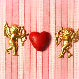 2 Brass Stamped Cupids - 1 Left and 1 Right Facing