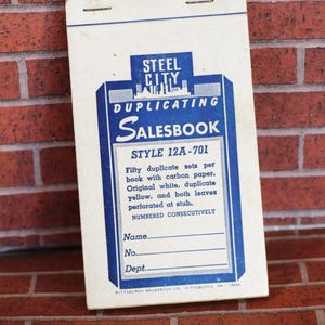 May include: Vintage Steel City Salesbook, style 12A-701, with blue and white design. Features fifty duplicate sets with carbon paper, original white and duplicate yellow leaves. Includes spaces for name, number, and department.