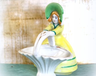 1 Vintage Japan Ceramic Woman and Basket Figurine