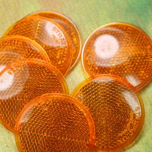 2 Vintage Plastic Stratolite Orange Reflectors