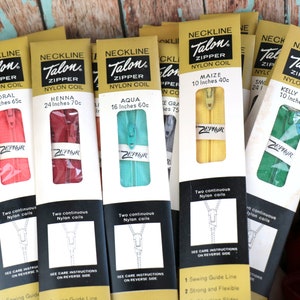 May include: Assortment of Talon zipper packages in various colors, including coral, henna, aqua, maize, and kelly green. Each package features a zipper with the brand name "Talon" and the text "Nylon Coil". The packages also include the length and price of each zipper.