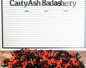 Vintage Sign Board with Black and Red Letters, Numbers, and Symbols