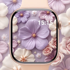 May include: A rose gold smartwatch with a floral display. The screen shows a digital clock displaying "FRI 24 15:15" surrounded by 3D rendered flowers in shades of purple, pink, and white. The watch band is a matching rose gold color.