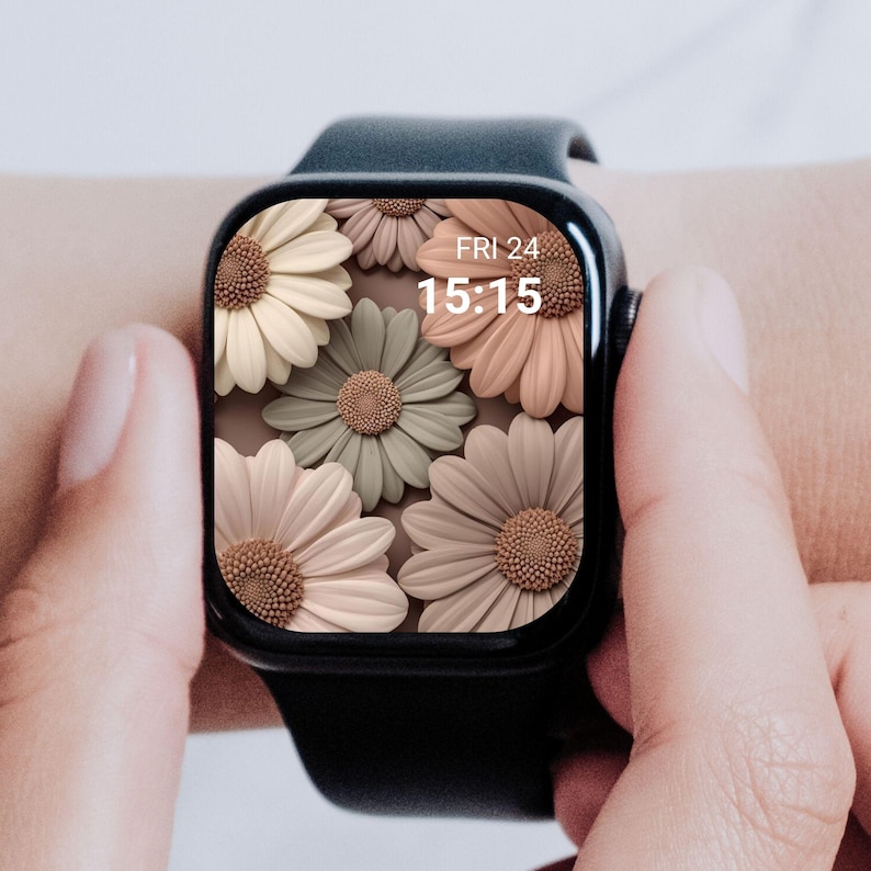 May include: A black smartwatch displaying a floral design with daisy-like flowers in cream, peach, and sage green. The screen shows the date, Friday the 24th, and the time, 15:15.