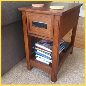 May include: A set of three ceramic mugs with a speckled, matte finish. The mugs are in shades of cream, light gray, and dark gray. Each mug has a simple, minimalist design and a rounded handle.