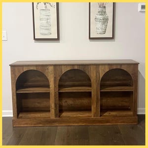 May include: A rustic wooden sign with the text "Welcome to our home" in a handwritten style. The sign features a distressed finish and a simple, inviting design, perfect for entryway decor.